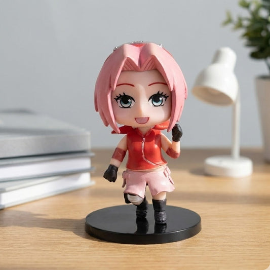9cm Sakura Haruno figure in combat pose, pink hair, standing against a blurred background.