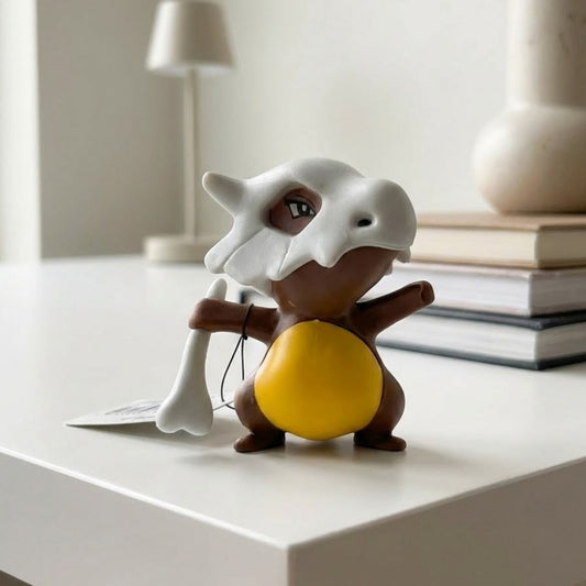 7cm Cubone figure with skull helmet, holding a bone, in a battle stance.